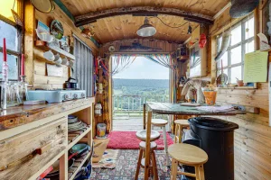 An image of the cooking and dining area looking out onto private views from our Avon Wagon based in Dalby Forest, North Yorkshire.
