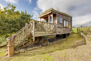 An outdoor image showing the exterior of our oxo glamping wagon in Dalby Forest, North Yorkshire.