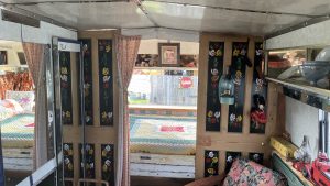 An interior image of the portmaster glamping wagon based in Dalby forest, North Yorkshire. A view of one of the double bedrooms.