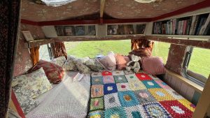 An interior image of the portmaster glamping wagon based in Dalby forest, North Yorkshire. One of the double beds.